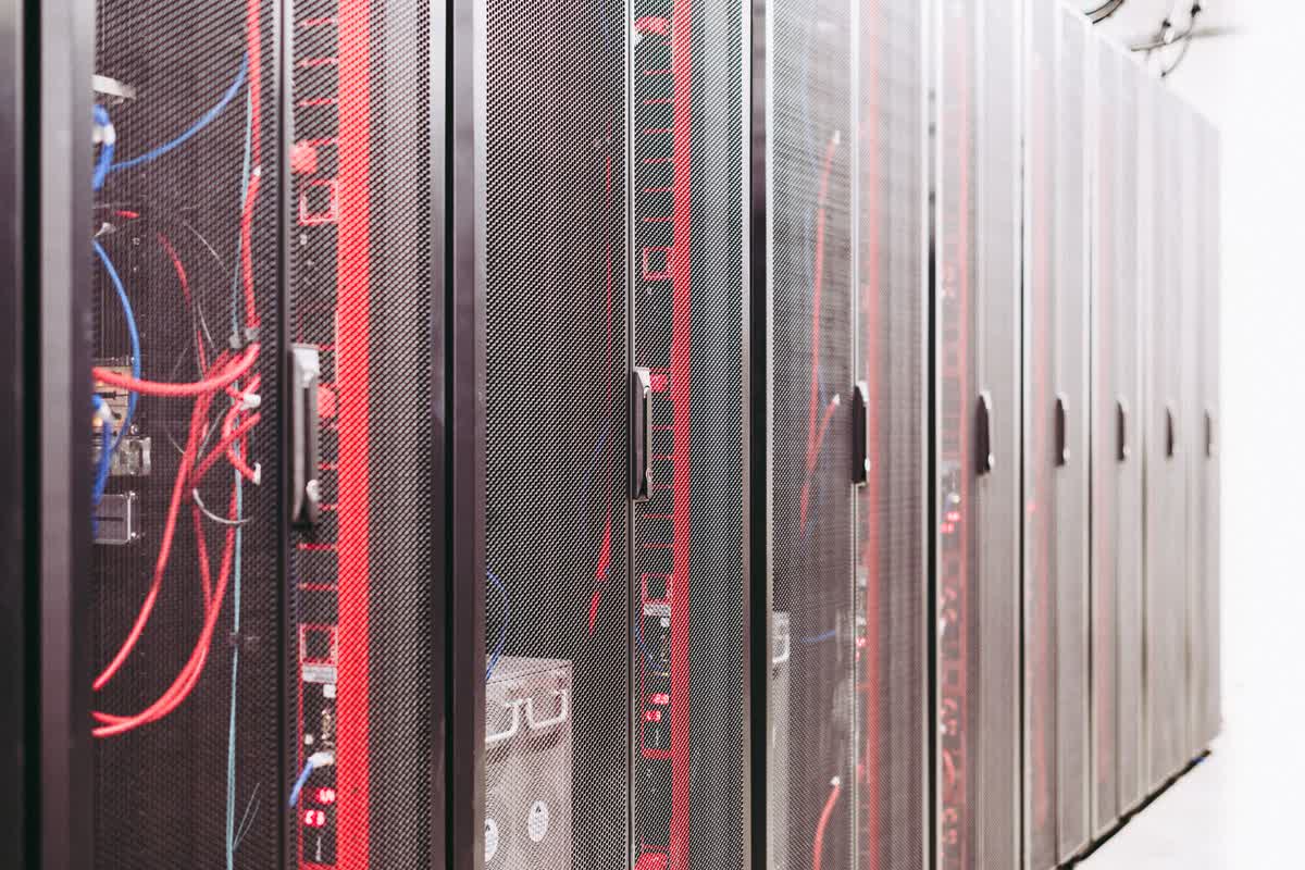 Wired server infrastructure in a data center: an illustrative image for a build-vs-buy data decision.
