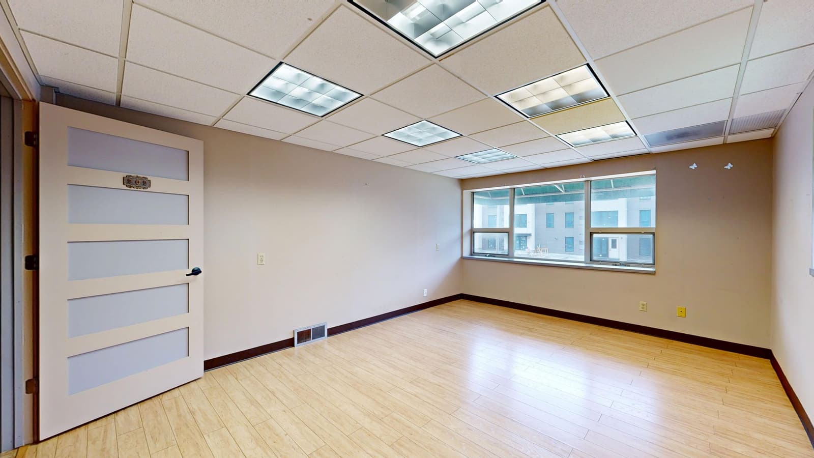 A bright, empty modern office space with natural light: an illustrative image for room to grow.