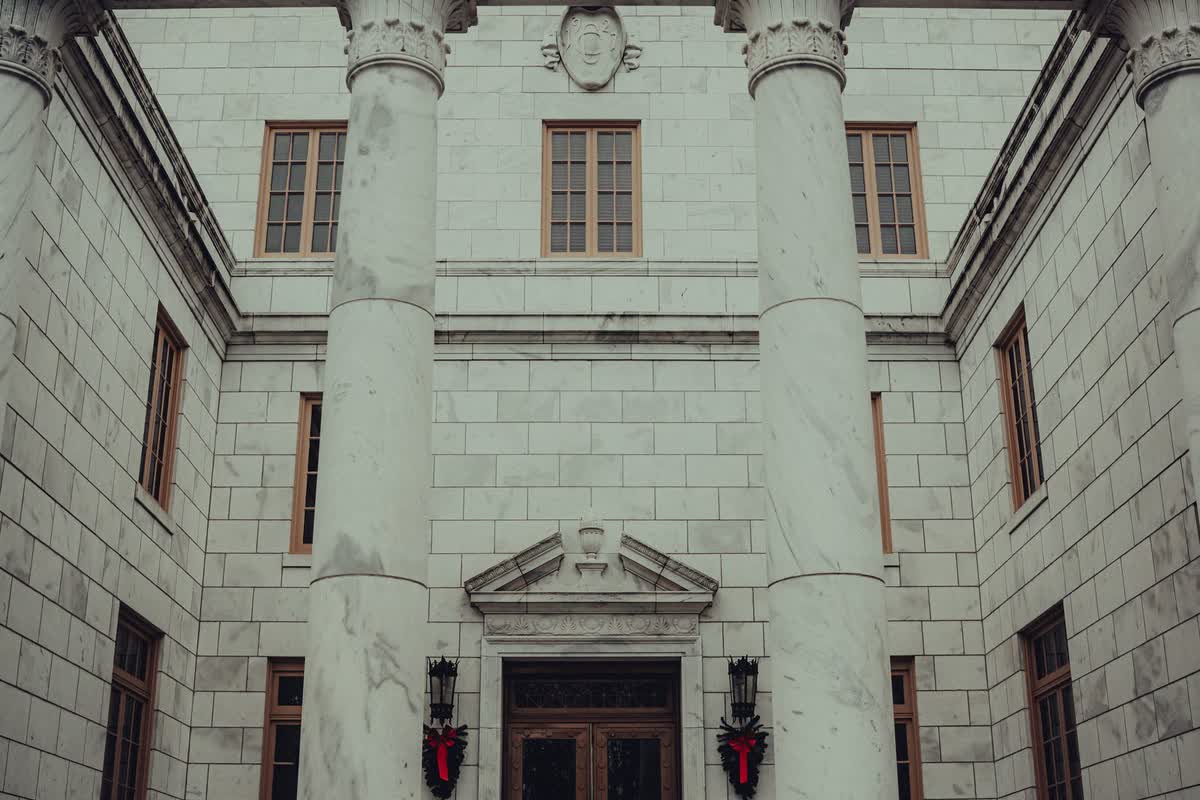 A stately institutional building with classical columns: an illustrative image for governance and compliance.