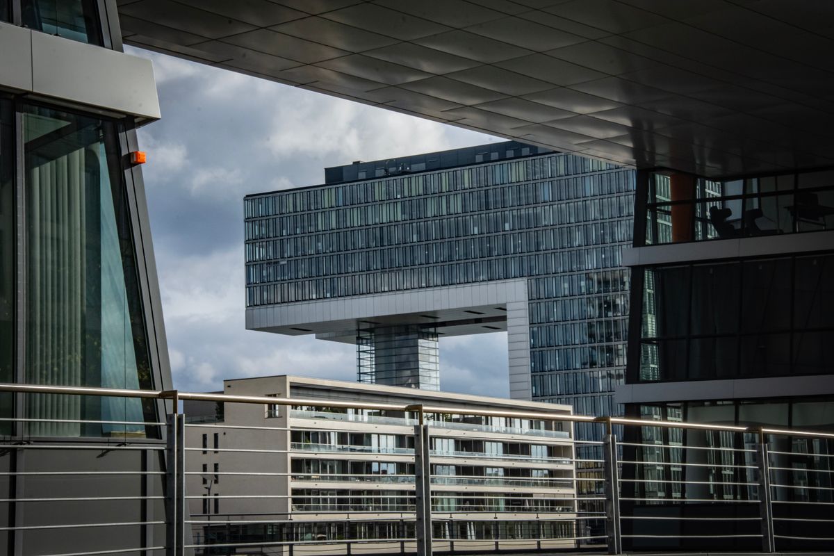 Sleek modern architecture at a harbour edge — an illustrative image for order, governance, and stewardship.