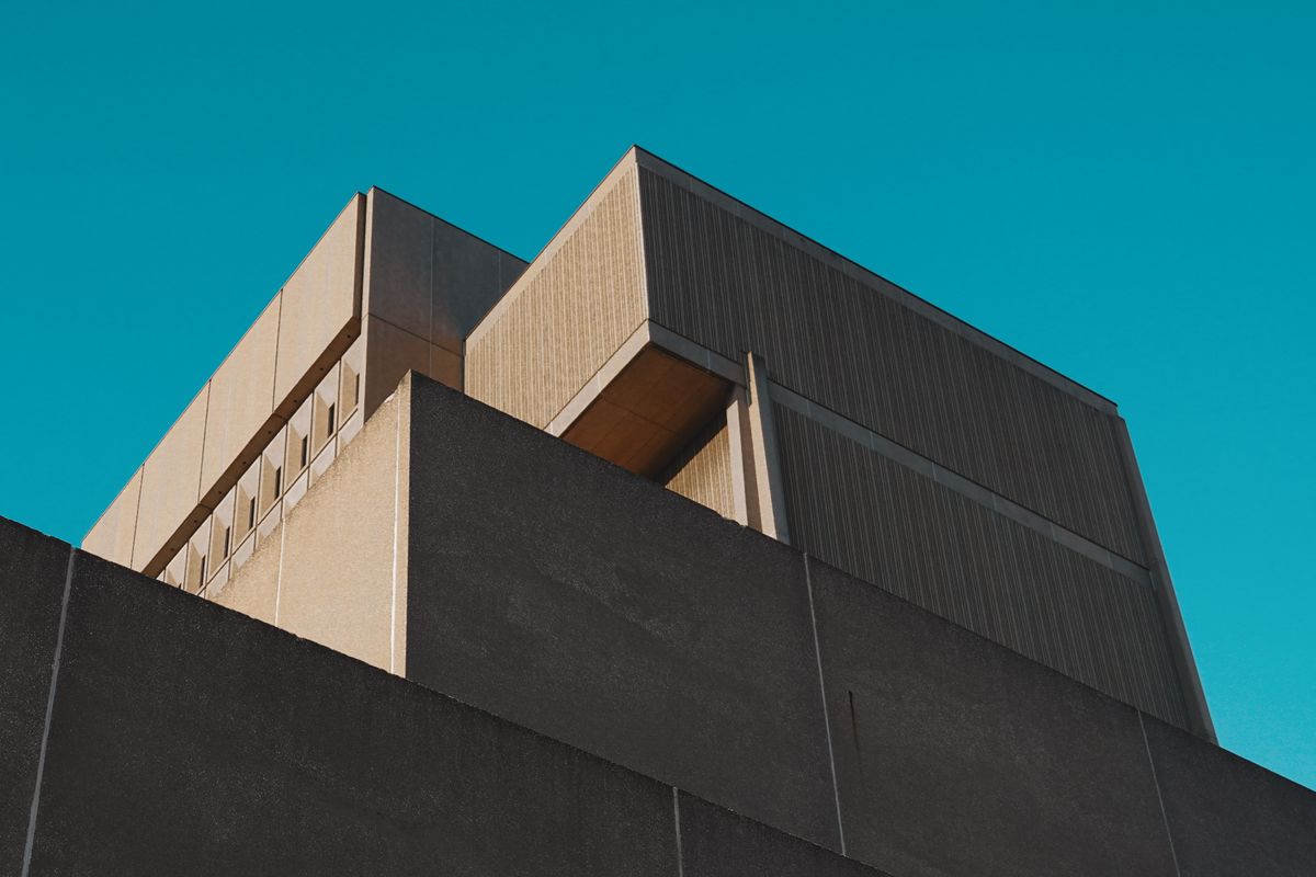A concrete structure rising against a clear sky — an illustrative image for durable, principled foundations.