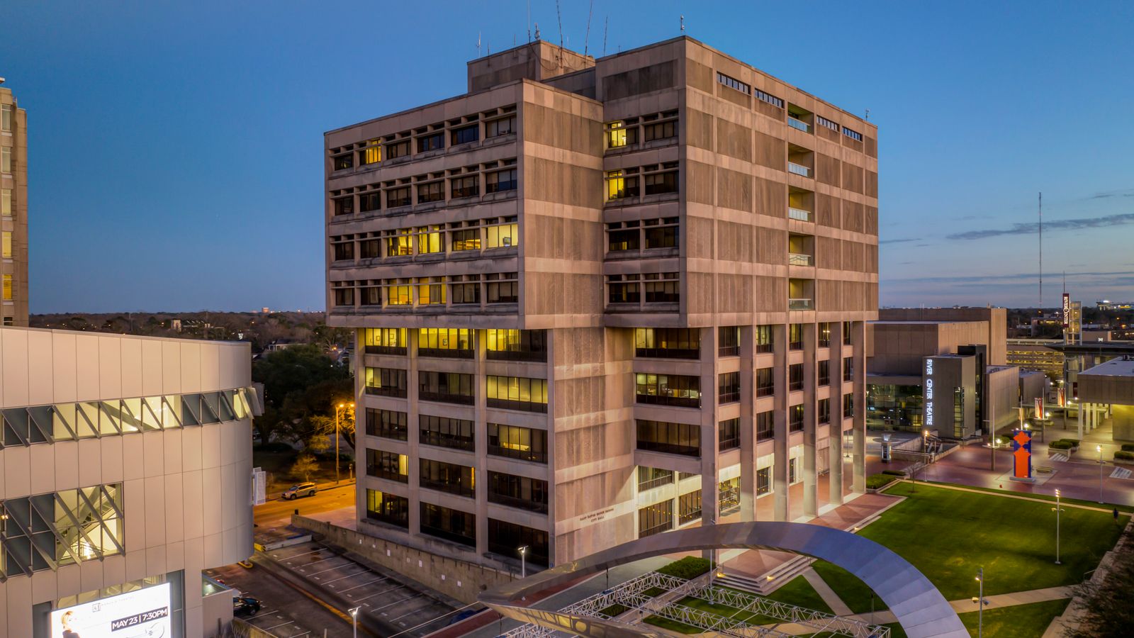 Aerial view of Baton Rouge City Hall and the downtown government plaza at twilight, an illustrative image for the firm's Baton Rouge service area.