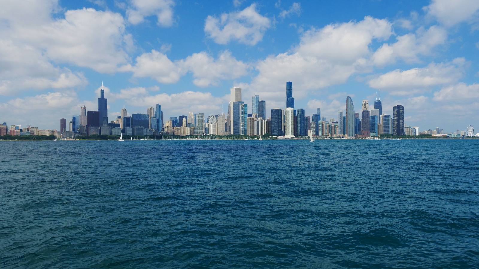 The Chicago skyline seen across Lake Michigan on a clear summer day, an illustrative image for the firm's Chicago service area.