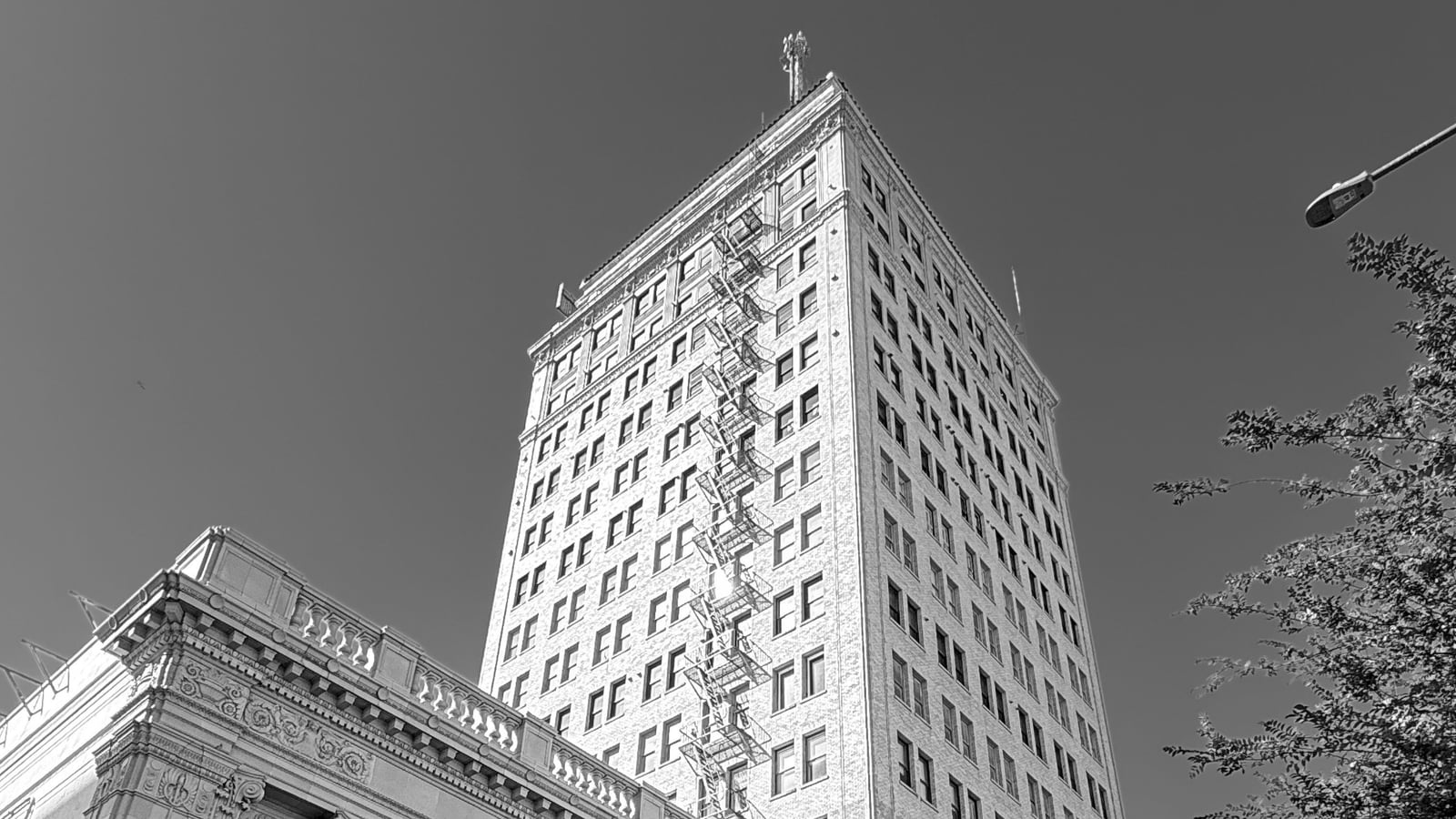 A historic brick tower building in downtown Fresno in black and white, an illustrative image for the firm's Fresno service area.