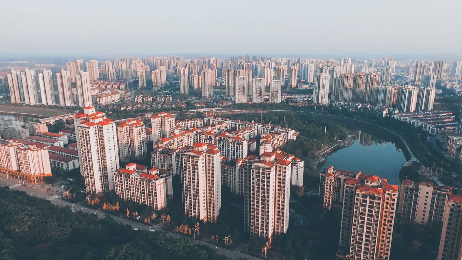An aerial view of a dense urban skyline in daylight — an illustrative image for metropolitan scale.