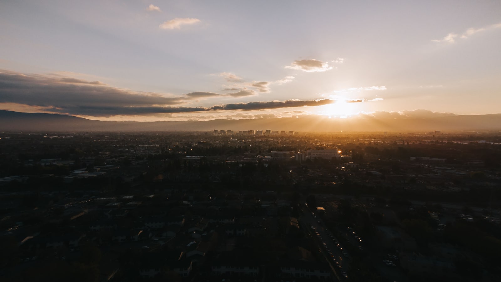 The San Jose skyline under a low sun above the Santa Cruz Mountains, an illustrative image for the firm's San Jose service area.