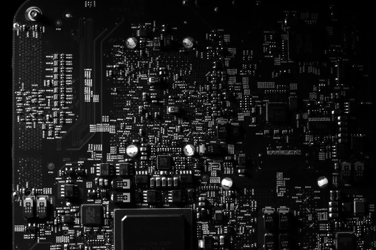 A black-and-white close-up of a circuit board: an illustrative image for AI applied to the work itself.