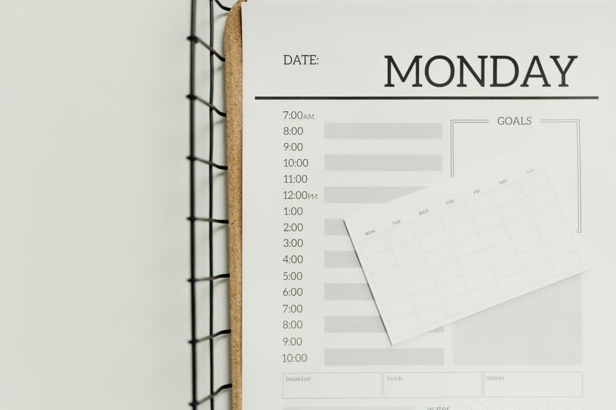 A minimalist schedule planner laid out on a table: an illustrative image for engagement structure and options.