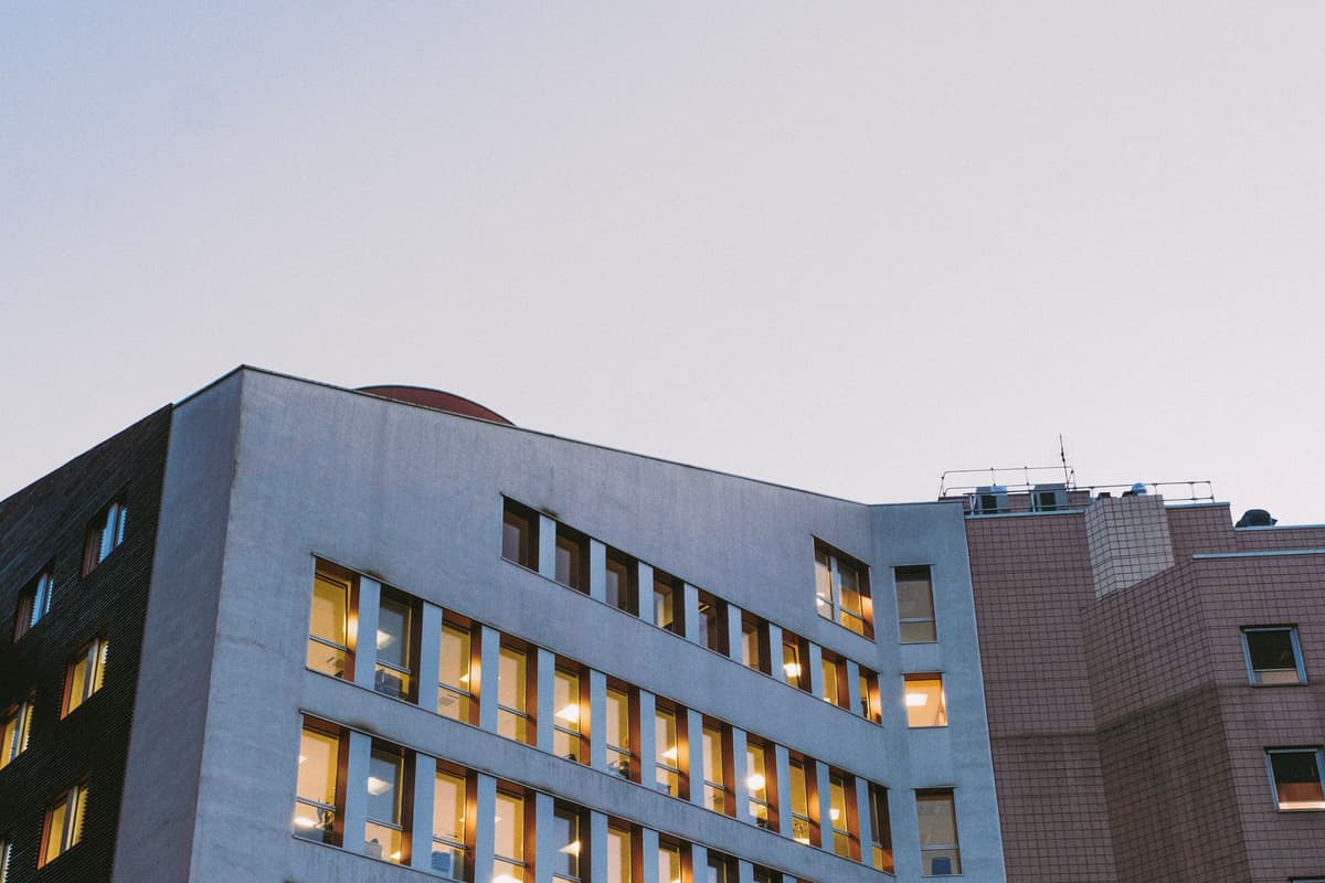 A large building facade with many windows: an illustrative image for healthcare-scale institutions.
