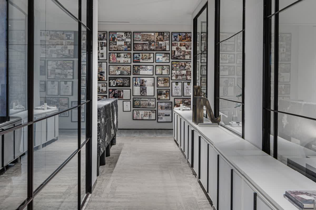A symmetrical modern office hallway with glass partitions: illustrative image for the breadth of the practice's work.