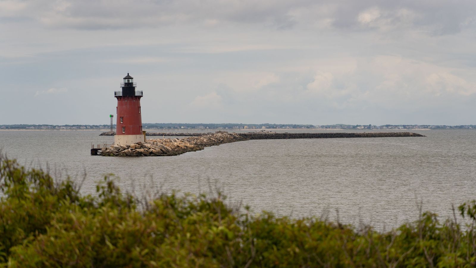 Breakwater Lighthouse at Lewes, Delaware, on a cloudy day: an illustrative image of the state.